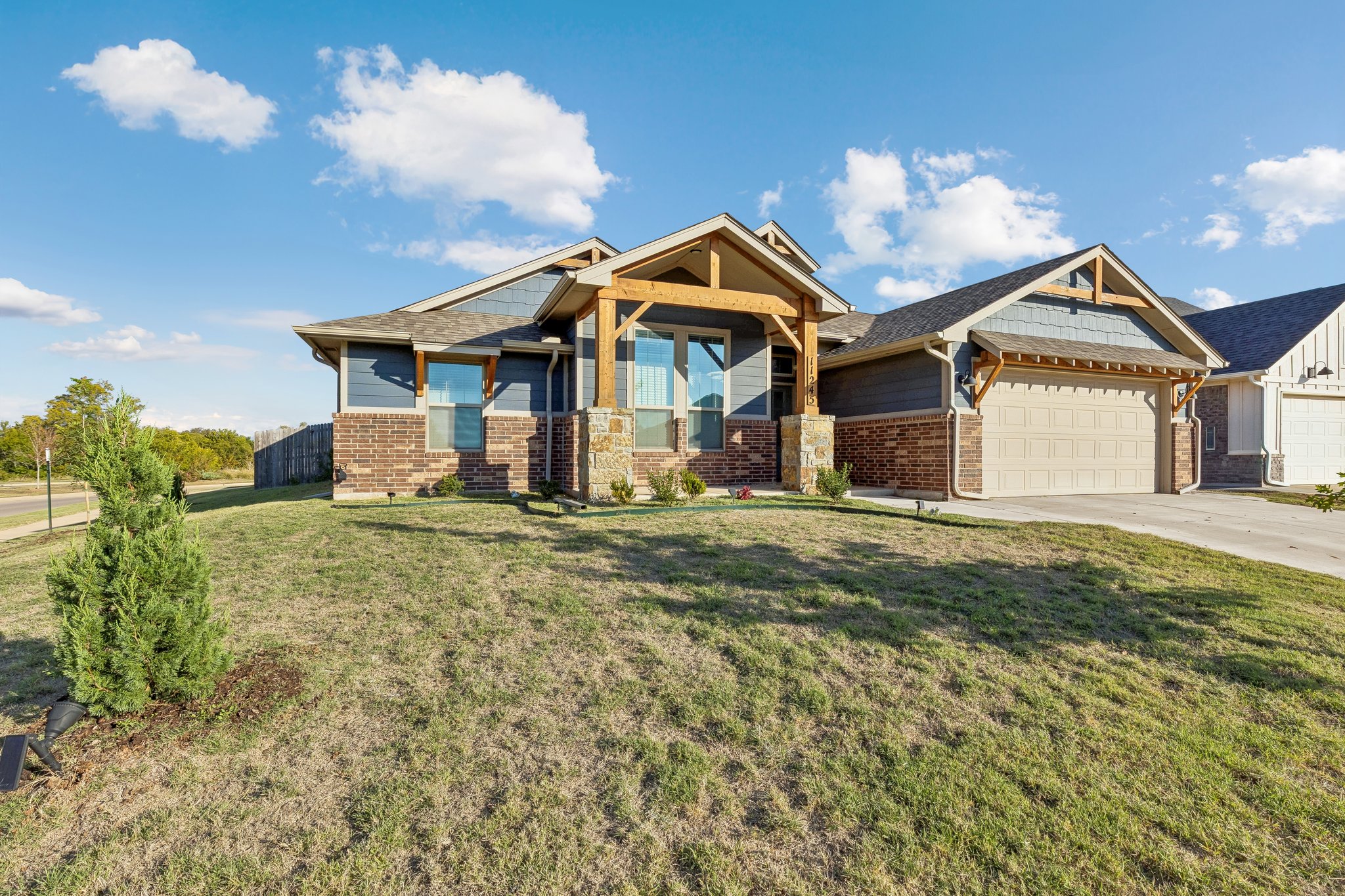 11245 NW 135th Street in Yukon, Oklahoma, with newly planted trees